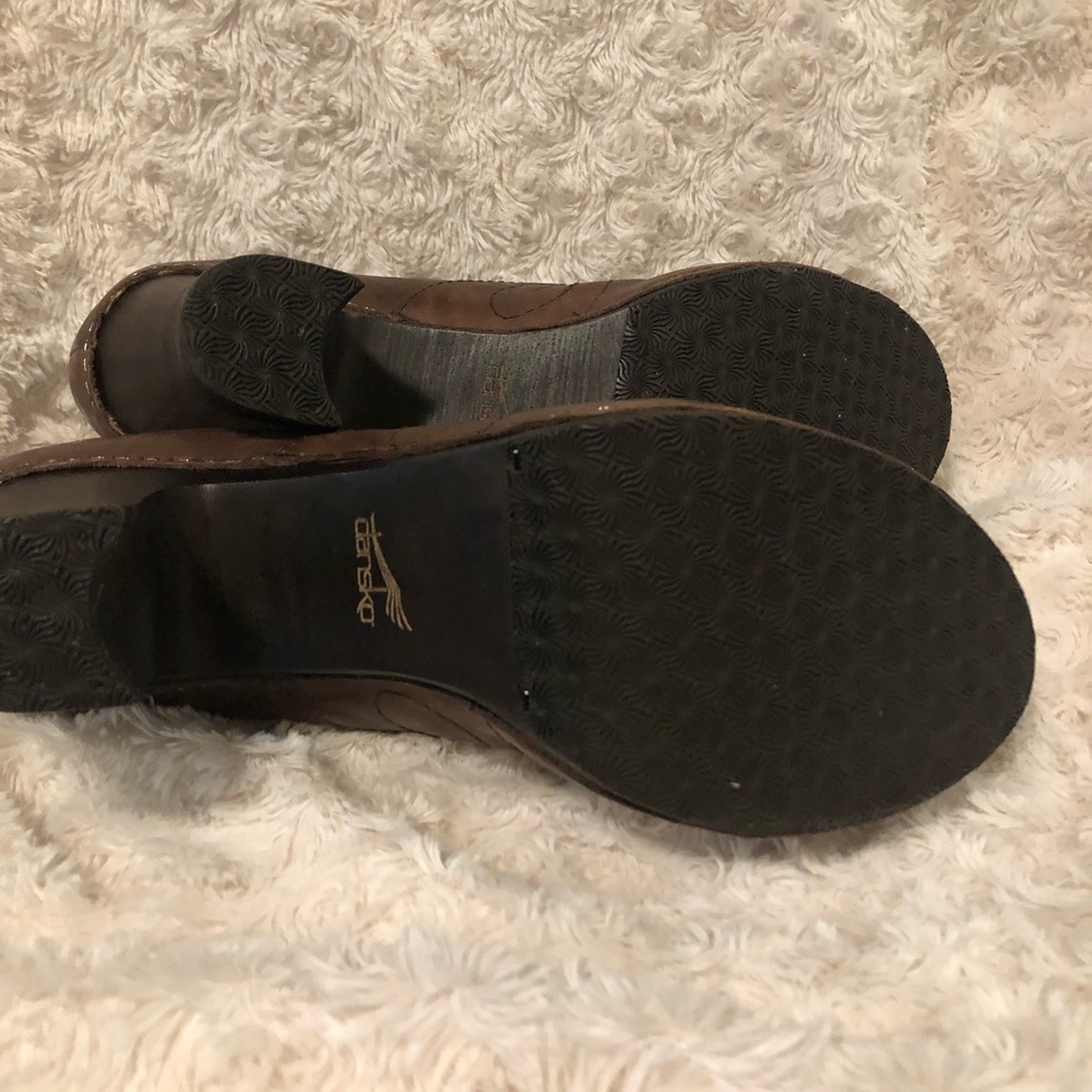 Dansko Lace-up heel. Never-worn. Leather